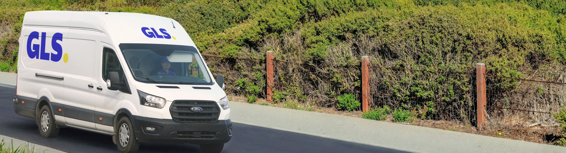 GLS delivery van driving on a street